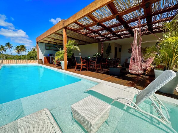 Indoor pool, outdoor pool, pool umbrellas, pool loungers