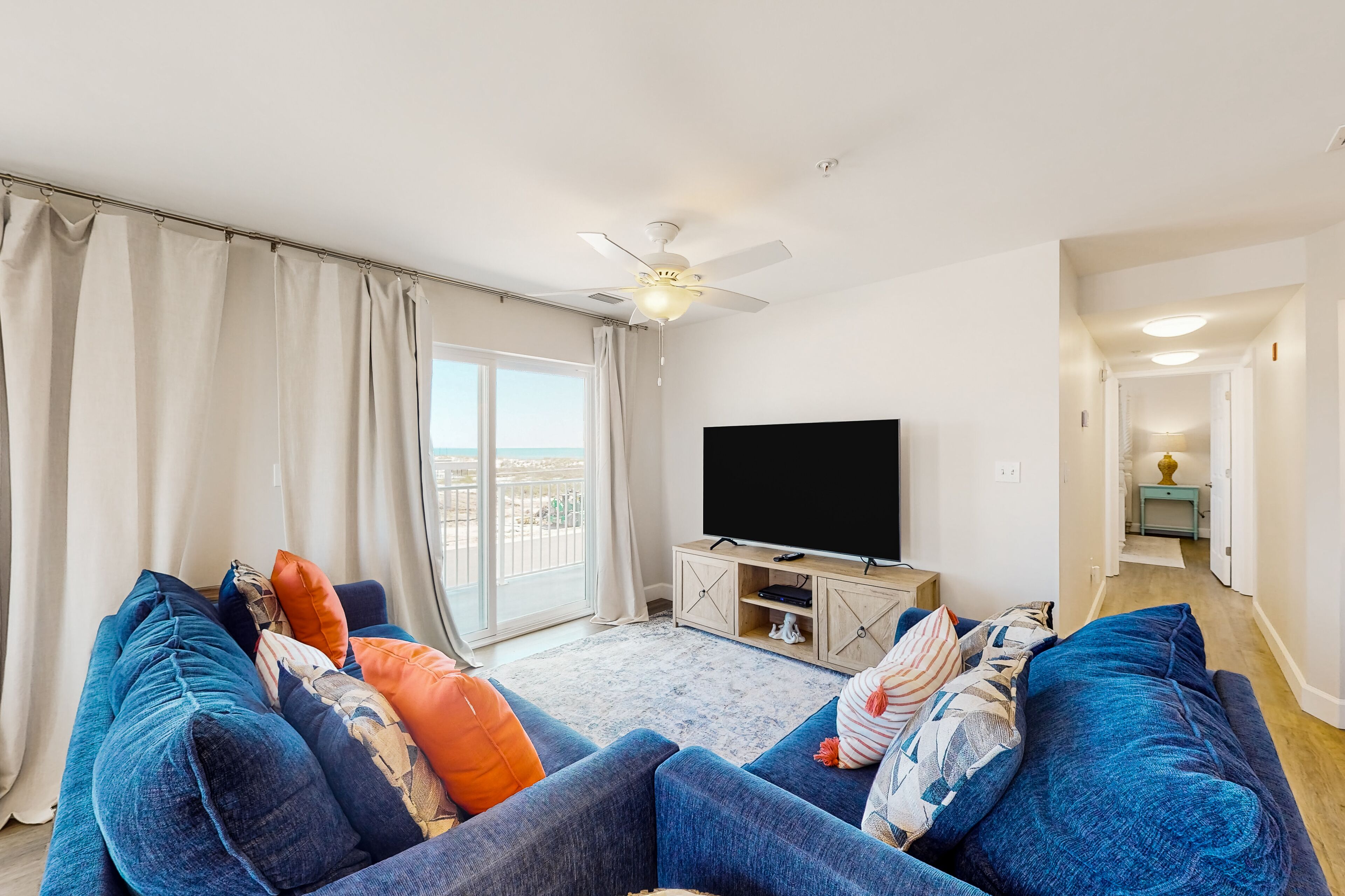 2nd-floor ocean-view condo with balcony, washer/dryer, & AC - close to the beach