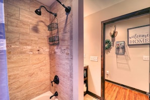 Bathtub, hair dryer, towels, soap