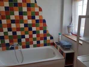 Shower, hair dryer, towels, toilet paper