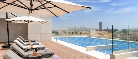 Outdoor pool, open 6:00 AM to 8:00 PM, pool umbrellas, sun loungers