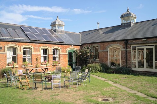 Converted stable block cottage with function room, courtyard garden & woodland