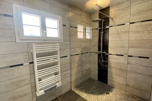 Shower, hair dryer, towels, toilet paper