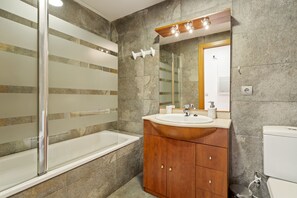 Shower, hair dryer, towels, toilet paper