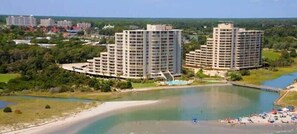 A coastal area with high-rise buildings, a beach, and a body of water. - Oceanfront Escape at Famous Ocean Creek Resort (Myrtle Beach)