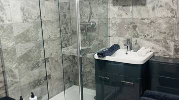 Shower, towels, soap, shampoo