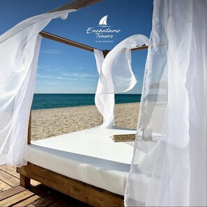 On the beach, sun loungers, beach towels