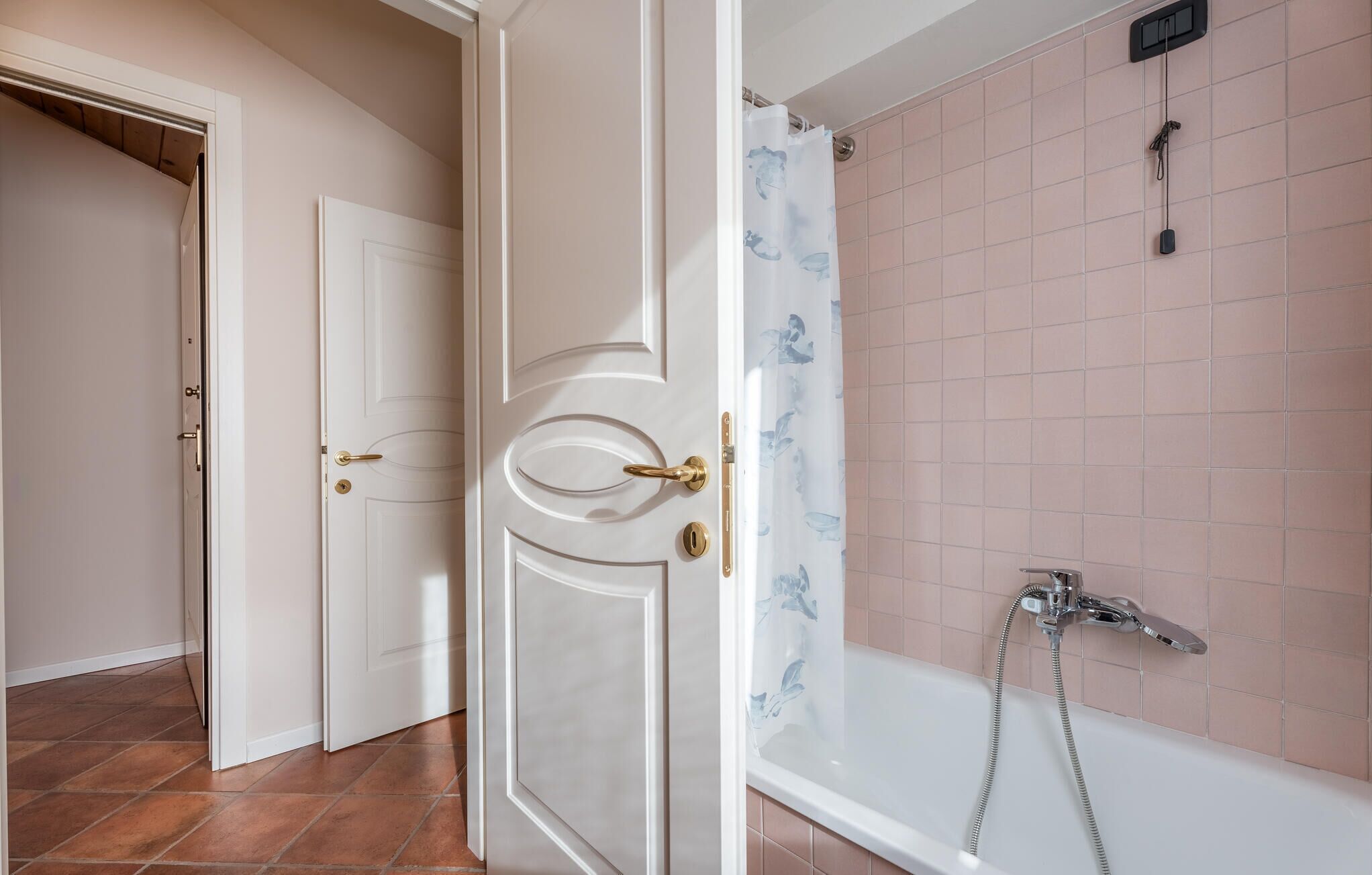 A bathroom with a bathtub, a shower, and a toilet.