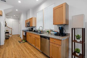 Enjoy cooking in this well-equipped kitchen with a dishwasher, microwave, and coffee maker.