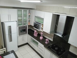 Fridge, microwave, oven, stovetop - *Beautiful and cozy house with pool near the beach. (Praia Grande)
