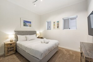 1 bedroom, desk, iron/ironing board, travel crib