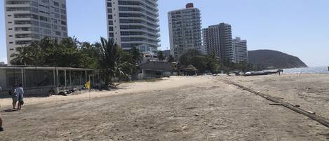 On the beach, sun loungers, beach towels