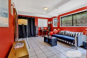 Comfort House | Living area | 20-inch flat-screen TV with satellite channels, TV - Pet Friendly on Redcliffe Peninsula (Scarborough)