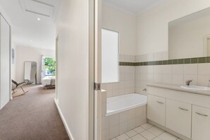 Bathtub, hair dryer, towels
