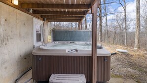 A hot tub under a wooden pergola with a view of a forested area. - 16 Acres of beauty and relaxation  (Park Hills)