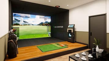 Experience golf in style with a large screen displaying a virtual golf course and a golf bag at the ready.