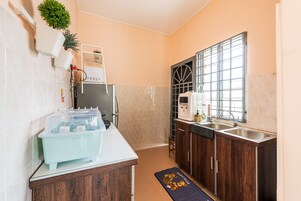 Family House | Private kitchen | Fridge, microwave, cookware/dishes/utensils, dining tables