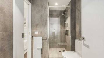 Shower, hair dryer, towels, soap