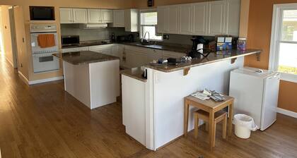 Lake Front Cottage on Woodland Lake with private beach, boat and jet ski docks.