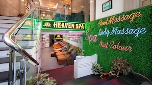 A spa reception area with a neon sign for 'Heaven Spa' and 'Foot Massage' services. - THE SILK BOUTIQUE HOTEL & SPA (Hanoi)