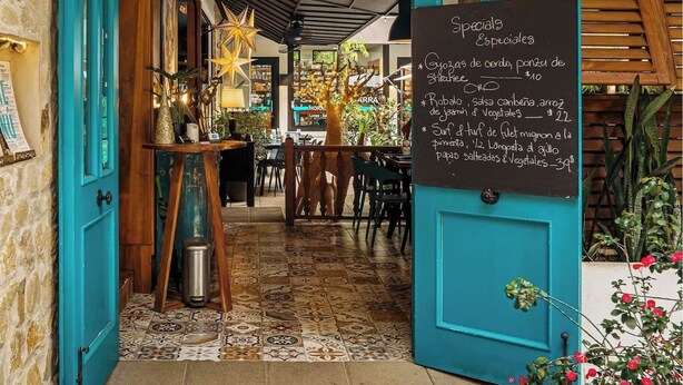 A restaurant entrance with a sign reading "CITRUS" and a chalkboard listing specials. - 3 bedroom. 10 min to Beach. Private Pool. (Ojochal)