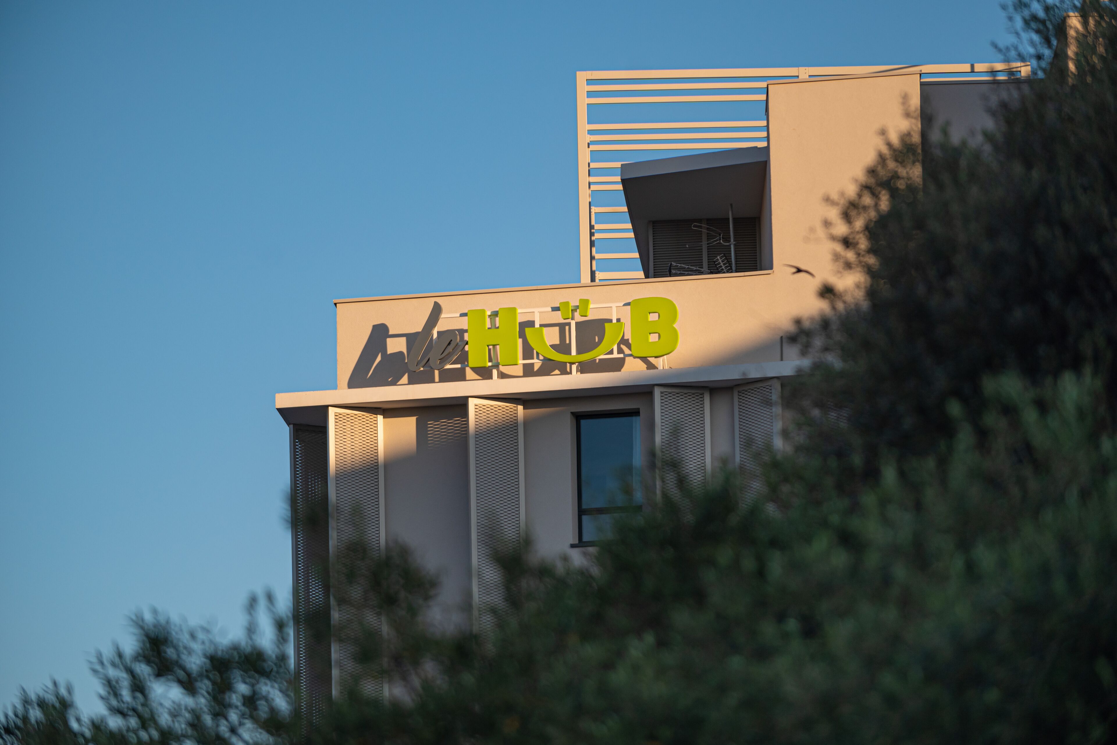 A modern building with a prominent sign reading "HUB".