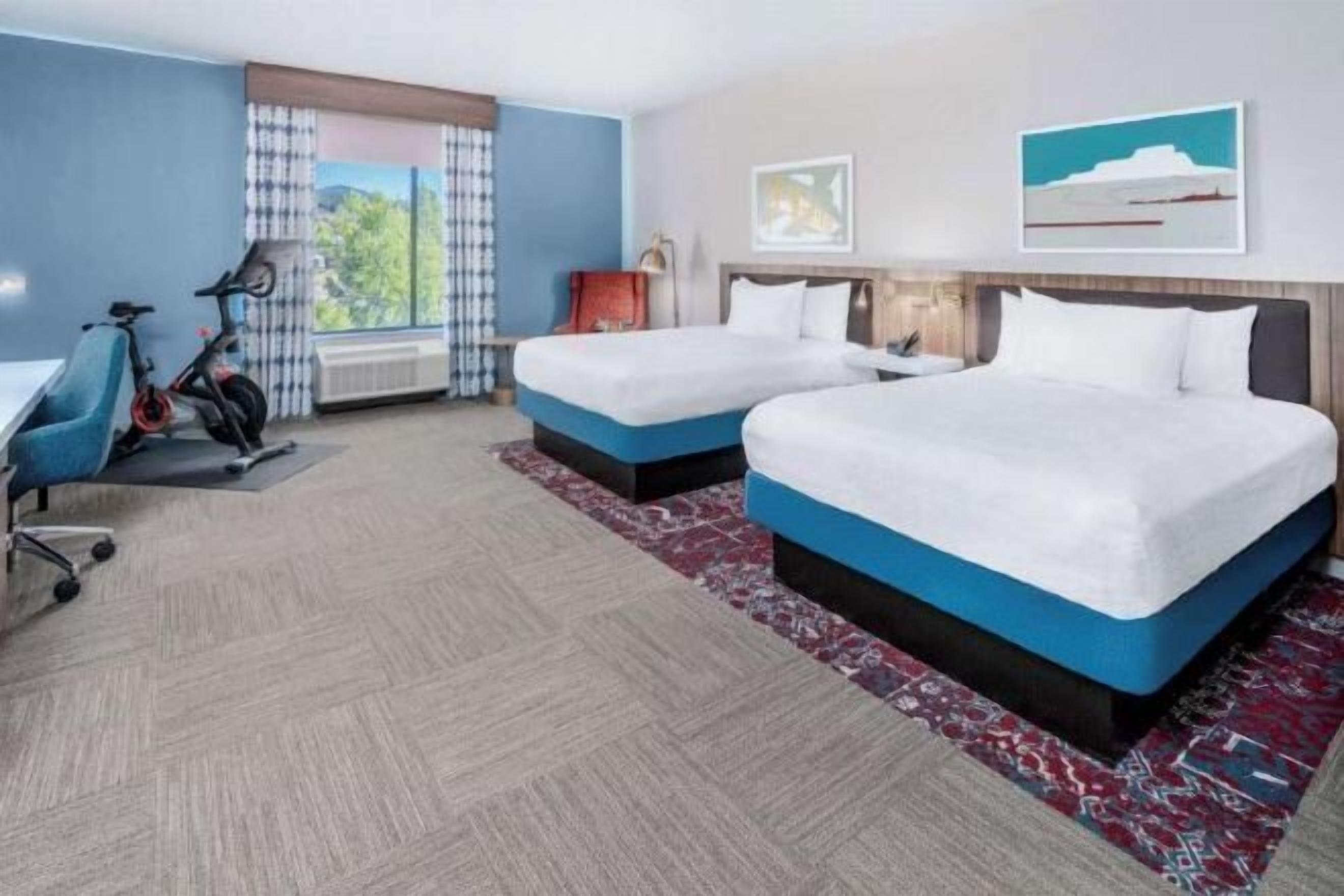 Desk, laptop workspace, blackout drapes, iron/ironing board