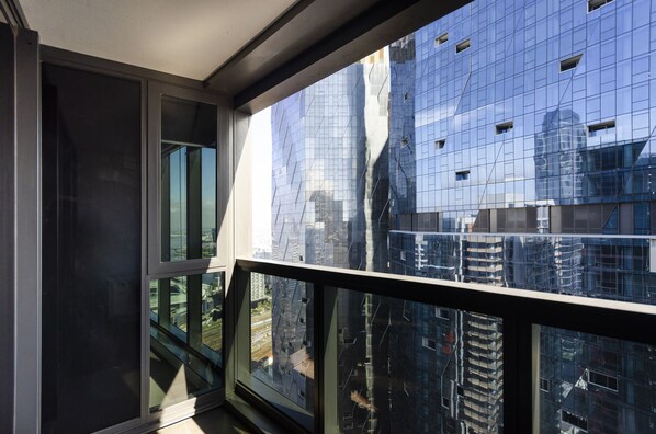 Contemporary building with a sleek glass facade and grid-like pattern.