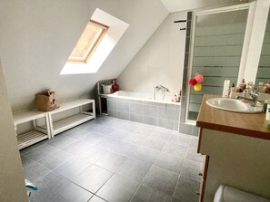 Shower, hair dryer, towels, toilet paper