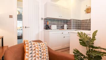 Fridge, electric kettle, toaster, cookware/dishes/utensils