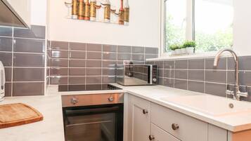 Fridge, electric kettle, toaster, cookware/dishes/utensils