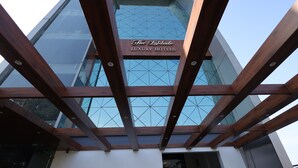 A modern building with a sign reading "The Latitude Luxury Hotels." - THE LATITUDE LUXURY  (Haridwar)