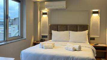 Habitación económica, para no fumadores, vista a la ciudad | 1 habitación, ropa de cama de alta calidad y minibar