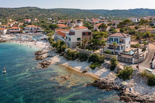 Luxury beachfront villa Sensation with private heated pool, sauna, gym, and jacuzzi on Ciovo