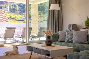Relax in a stylish living space with a tufted sofa, coffee table, and floor lamp.