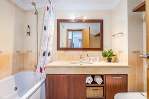 Bathtub, hair dryer, towels