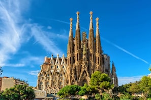A historic building with intricate stonework and multiple spires.