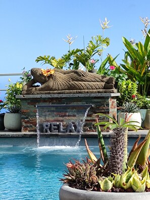 Outdoor pool, open 8:00 AM to 11:00 PM, pool loungers