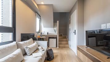 Duplex executivo | Área de estar | Smart TV 40 polegadas com canais digitais