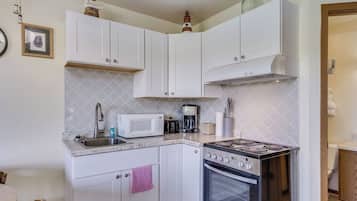 Mini-fridge, microwave, stovetop, coffee/tea maker