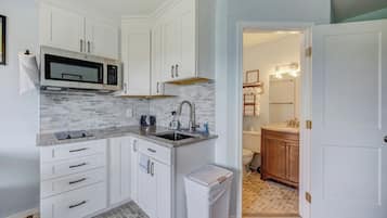 Mini-fridge, microwave, stovetop, coffee/tea maker