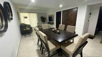 Comfort Condo | Private kitchen | Cookware/dishes/utensils, dining tables