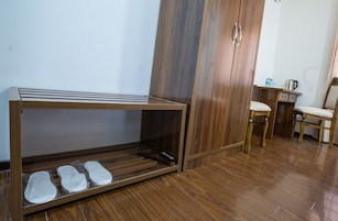 Classic Triple Room | Living area | 45-inch plasma TV with cable channels, TV