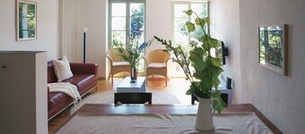 TURMVILLA upper floor: balcony, wood-burning stove and water access