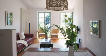 TURMVILLA upper floor: balcony, wood-burning stove and water access