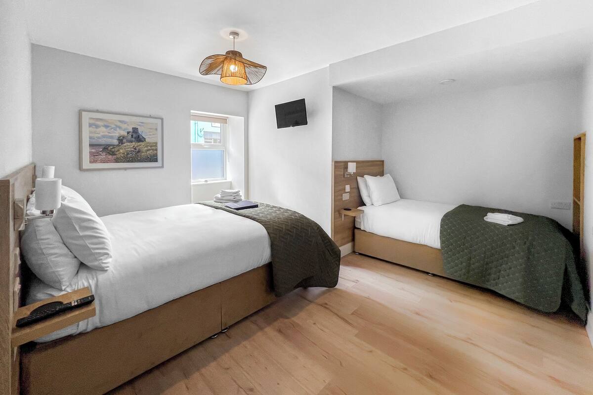 Premium bedding, pillow-top beds, blackout curtains, soundproofing