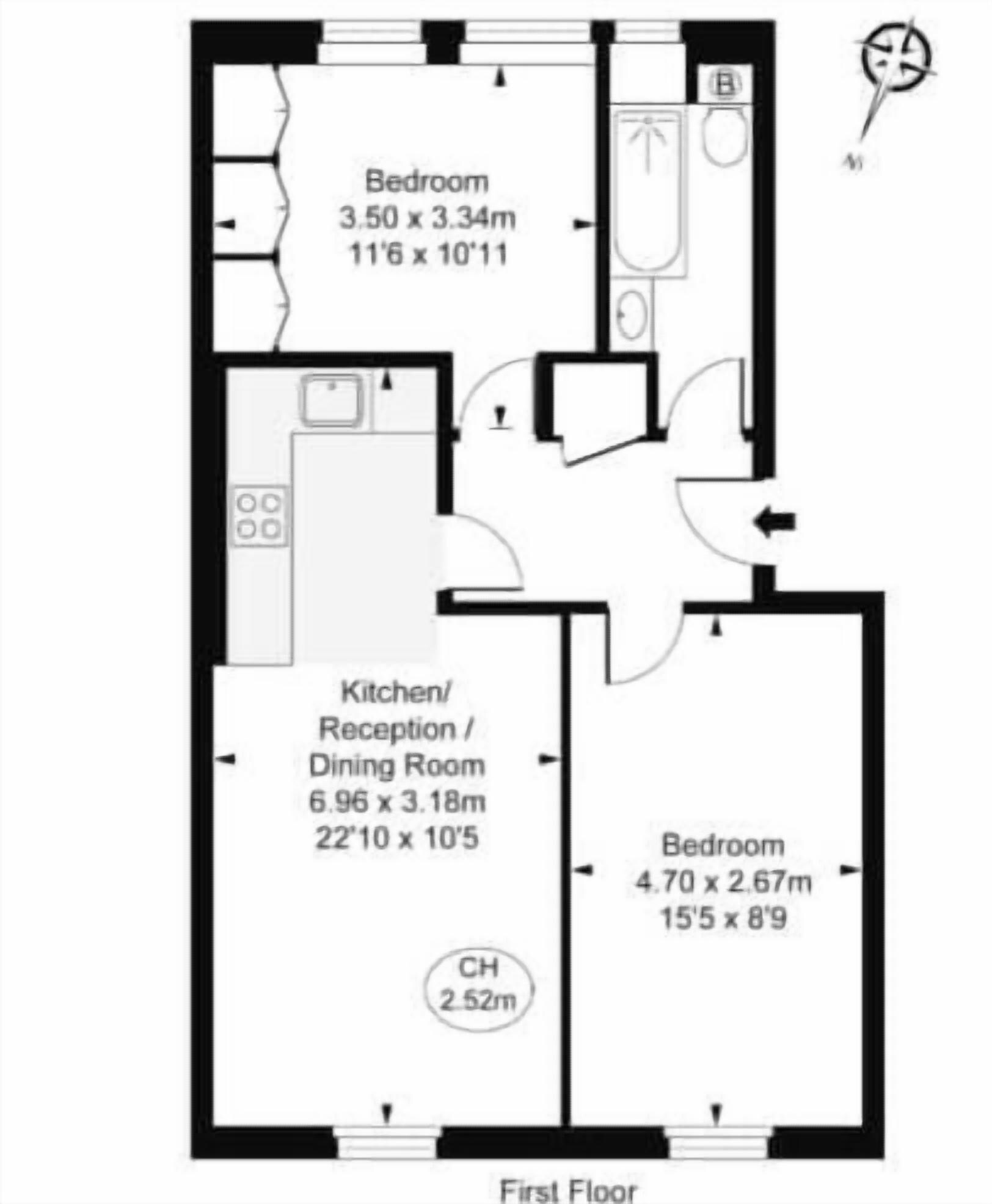 Plattegrond van de eerste verdieping met drie slaapkamers, een keuken/eetruimte en een badkamer.