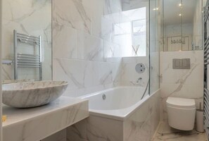 Bathtub, hair dryer, towels