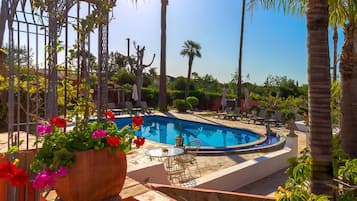 2 outdoor pools, open 10:00 AM to 7:00 PM, pool umbrellas, pool loungers