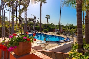 2 outdoor pools, open 10:00 AM to 7:00 PM, pool umbrellas, pool loungers